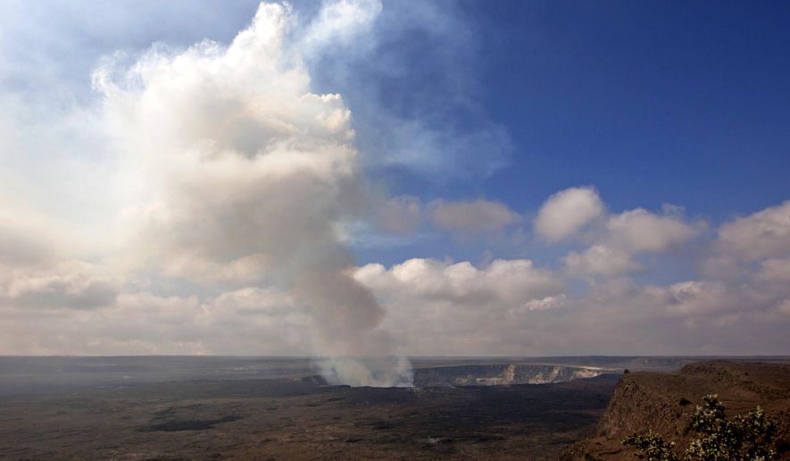FILE - This Sept. 1, 2015 file photo shows volcanic gas rising from the lava lake in Kilauea's Halemaumau Crater in Hawaii Volcanoes National Park on Hawaii's Big Island. A 38-year-old man has died on Kilauea volcano. Park spokeswoman Jessica Ferracane said Monday, July 10, 2017 that the man was found on the caldera floor about 250 feet below Crater Rim Trail. (AP Photo/Caleb Jones, File)