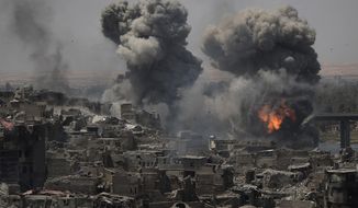 Airstrikes target Islamic State positions on the edge of the Old City a day after Iraq&#39;s prime minister declared &amp;quot;total victory&amp;quot; in Mosul, Iraq, Tuesday, July 11, 2017. (AP Photo/Felipe Dana)