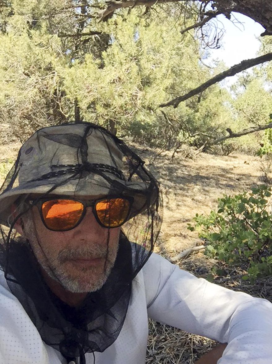This July 6, 2017, photo provided by Charles Brandenburg shows his self portrait taken along the Pacific Crest Trail near Tehachapi, Calif. Volunteer rescuers who were coming to the aid of Brandenburg, who had become dehydrated, were held up by armed men on the Pacific Crest Trail in the Piute Mountains near Tehachapi, Calif., about 85 miles north of Los Angeles. Authorities closed the trail after the robbery and airlifted Brandenburg and three other backpackers trying to hike the 2,650-mile (4,265-kilometer) route from Mexico to Canada on the trail. (Charles Brandenburg via AP)