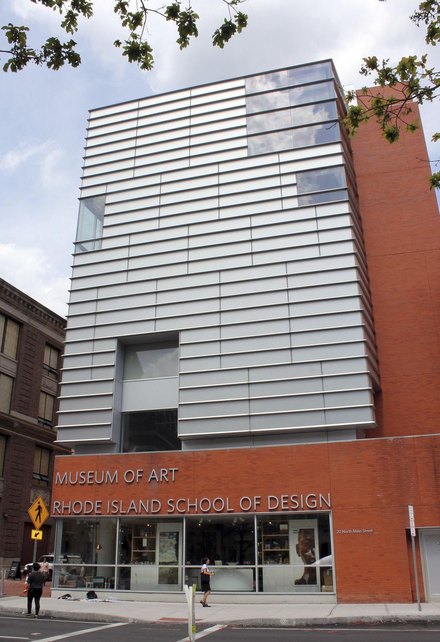 In this July 10, 2017 photo, people walk past the Rhode Island School of Design's RISD Museum of Art in Providence, R.I. With a plethora of street art and a world-famous design school, the city provides plenty to do for art-loving travelers. (AP Photo/Michelle R. Smith)