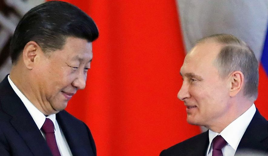 Russian President Vladimir Putin, right, and Chinese President Xi Jinping attend a signing ceremony following their talks in the Kremlin in Moscow, Russia, Tuesday, July 4, 2017. Chinese President Xi Jinping meets with Russia&#39;s President Vladimir Putin for talks on boosting ties between the two allies. (Sergei Ilnitsky/Pool Photo via AP) (credit)