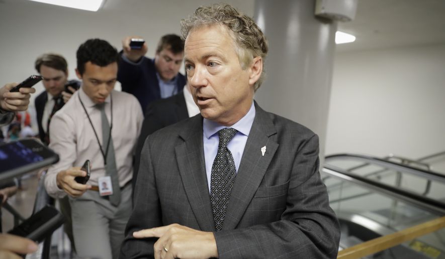 Sen. Rand Paul, R-Ky., a vocal opponent of the Senate Republican healthcare bill, speaks with reporters on his way to a vote on Capitol Hill in Washington, Wednesday, July 12, 2017. (AP Photo/J. Scott Applewhite)