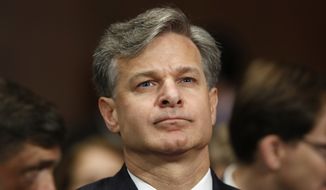 FBI Director nominee Christopher Wray prepares to testify on Capitol Hill in Washington, Wednesday, July 12, 2017, at his confirmation hearing before the Senate Judiciary Committee. (AP Photo/Pablo Martinez Monsivais)
