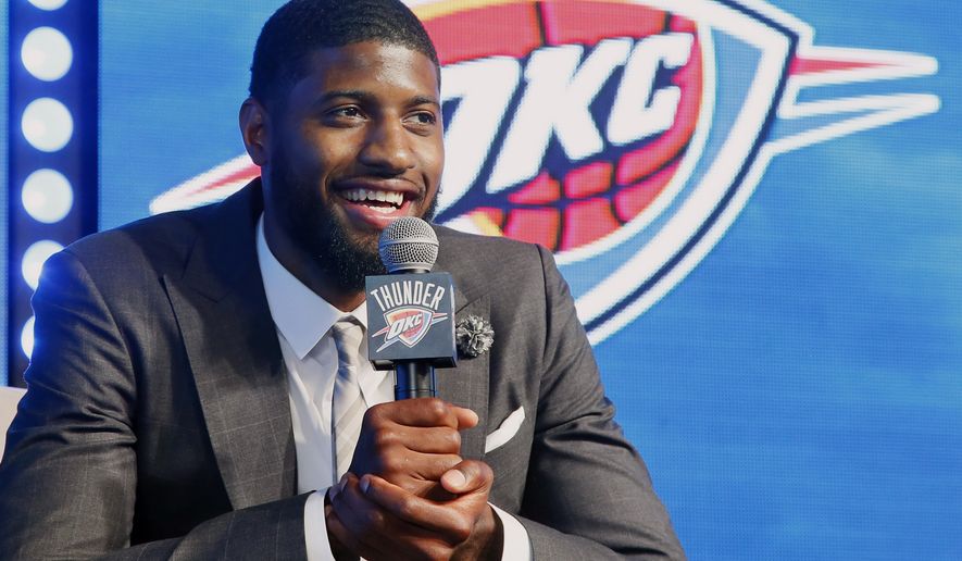 Oklahoma City Thunder forward Paul George speaks to at a rally to introduce him to fans in Oklahoma City, Wednesday, July 12, 2017. (AP Photo/Sue Ogrocki)