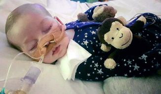 This is an undated photo of sick baby Charlie Gard provided by his family, taken at Great Ormond Street Hospital in London. A British court will assess new evidence Monday July 10, 2017, in the case of 11-month-old Charlie Gard as his mother pleaded with judges to allow the terminally ill infant to receive experimental treatment for his rare genetic disease, mitochondrial depletion syndrome. (Family of Charlie Gard via AP)