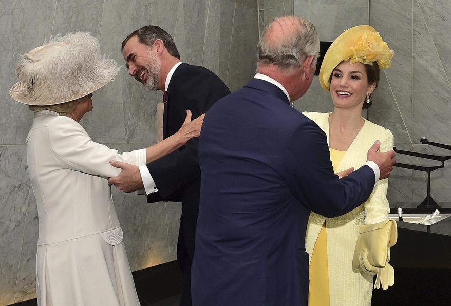 Britain's Camilla, Duchess of Cornwall, left,, and Prince Charles, 2nd right, greet Spain's King Felipe and Queen Letizia at a hotel in London, Tuesday July 12, 2017. The King and Queen of Spain are on a three day State Visit to Britain. (Hannah McKay/Pool via AP)