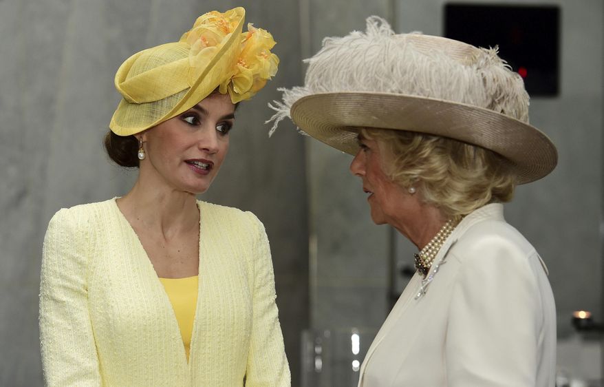 Britain's Camilla, Duchess of Cornwall, right, greets Spain's Queen Letizia at a hotel in London, Tuesday July 12, 2017. The King and Queen of Spain are on a three day State Visit to Britain. (Hannah McKay/Pool via AP)