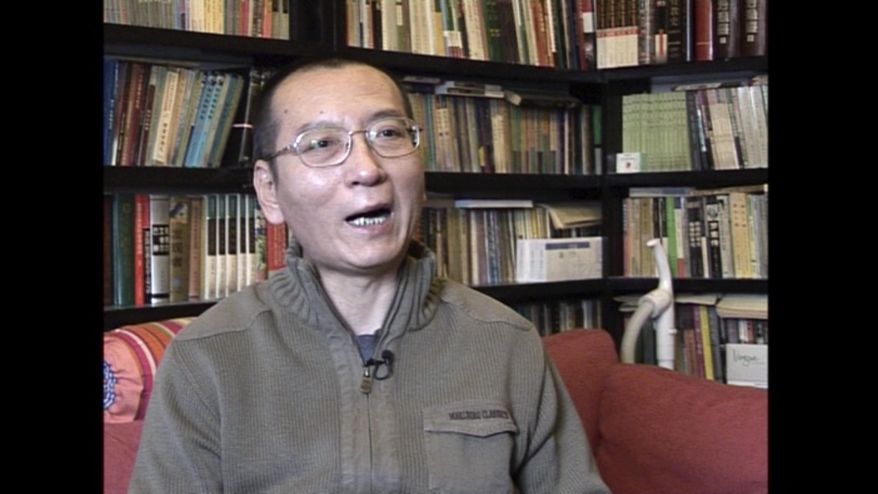 FILE - In this file image taken from Jan 6, 2008, video footage by AP Video, Liu Xiaobo speaks during an interview in his home in Beijing, China. Liu is in life-threatening condition with multiple organ failure and his family has opted against inserting a breathing tube needed to keep him alive, the hospital treating him said Wednesday. (AP Video via AP, File)