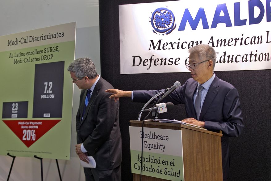 Thomas Saenz, president and general counsel with the Mexican American Legal Defense and Educational Fund, commonly known as MALDEF, left, and Bill Lann Lee, senior counsel, Civil Rights Education and Enforcement Center, (CREEC), a former Assistant U.S. Attorney General for Civil Rights, announce the filing of a Medi-Cal civil rights complaint in Los Angeles on Wednesday, July 12, 2017. The lawsuit alleges the state is violating Latinos' civil rights by providing low reimbursements to health care providers. It alleges the low payments often mean that those who rely on Medi-Cal, the state's health care program for the poor, are denied timely and quality medical care. (AP Photo/Damian Dovarganes)