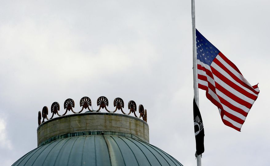In this file photo, the United States flag flies at half-staff over the state Capitol in Raleigh, N.C., Wednesday, July 12, 2017, following the death of six Marines and a Navy sailor from Camp Lejeune, who were among the 16 service members killed Monday when their plane crashed in a field in rural Mississippi. The plane was a KC-130T, a tanker from Marine Aerial Refueling and Transport Squadron 452, a Marine Forces Reserve unit based in Fort Stewart, N.Y. (AP Photo/Gerry Broome) **FILE**
