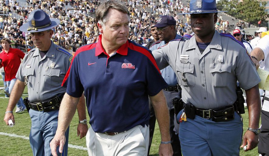 FILE - In this Sept. 17, 2011, file photo, Mississippi head coach Houston Nutt leaves the field after losing to Vanderbilt 30-7 in an NCAA college football game, in Nashville, Tenn. Former Mississippi coach Houston Nutt has filed a civil lawsuit against the university and its athletics foundation, alleging a breach of his contract because of false statements he says school officials made during an ongoing NCAA investigation.The lawsuit was filed Wednesday, July 12, 2017, in federal court in Mississippi. (AP Photo/Mark Humphrey, File)