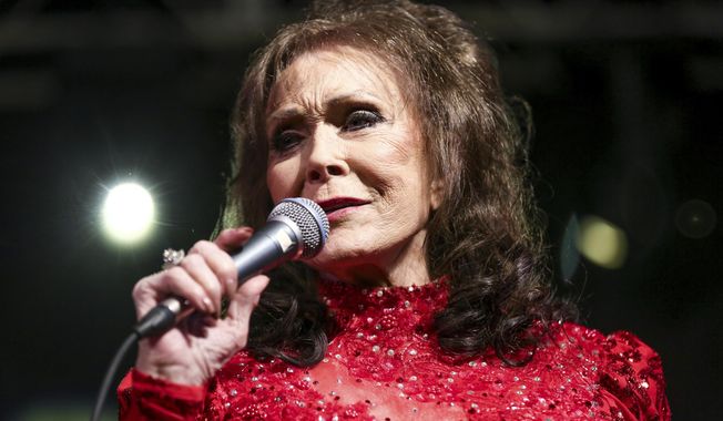 FILE - In this March 17, 2016, file photo, Loretta Lynn performs at the BBC Music Showcase at Stubb&#x27;s during South By Southwest in Austin, Texas. Lynn is back at home recovering after a stroke she suffered in May, but her next album will be delayed until next year and all her remaining tour dates this year have been cancelled. (Photo by Rich Fury/Invision/AP, File)