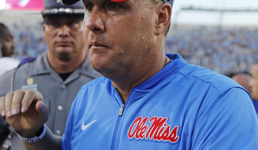 FILE - In this Sept. 17, 2016, file photo, Mississippi head coach Hugh Freeze walks off the field following a loss to No. 1 Alabama in an NCAA college football game, in Oxford, Miss. Gus Malzahn, Kevin Sumlin and Hugh Freeze arrived in the SEC West with reputations for breakneck fast offenses and winning, and have had seasons where they lived up to the billing. All three find themselves potentially on the hot seat, while it's getting a little warm for Arkansas' Bret Bielema and Tennessee's Butch Jones. (AP Photo/Rogelio V. Solis, File)