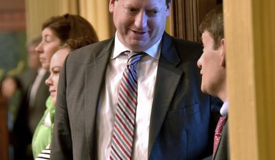 Rep. Tim Greimel, D-Auburn Hills talks with other legislators as the Michigan House of Representatives debates and votes-on the &amp;quot;Good Jobs Bills,&amp;quot; on Wednesday, July 12, 2017, in the Capitol in Lansing, Mich. (Dale G Young/Detroit News via AP)
