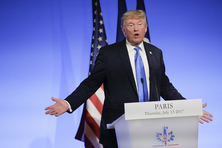 U.S President Donald Trump gestures during a press conference with French President Emmanuel Macron at the Elysee Palace in Paris, Thursday, July 13, 2017. President Donald Trump is saluting the United States' "unbreakable" bond with France. (AP Photo/Markus Schreiber)