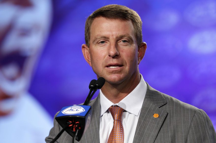 Clemson coach Dabo Swinney speaks to reporters during the Atlantic Coast Conference NCAA college football media day in Charlotte, N.C., Thursday, July 13, 2017. (AP Photo/Chuck Burton)