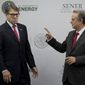 Mexico&#39;s Secretary of Energy Pedro Joaquin Coldwell, right, talks to his U.S. counterpart Rick Perry, after making a joint statement in Mexico City, Thursday, July 13, 2017. (AP Photo/Eduardo Verdugo)