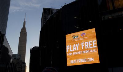 FILE - In this Jan. 6, 2016 file photo, an electronic advertisement for DraftKings hangs on the side of Madison Square Garden in New York. On Thursday, July 13, 2017, DraftKings announced it pulled out of a proposed merger with FanDuel, scrapping potential partnership between fantasy sports companies. (AP Photo/Mark Lennihan, File)