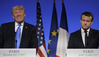 U.S President Donald Trump, left, speaks during a press conference with French President Emmanuel Macron at the Elysee Palace in Paris, Thursday, July 13, 2017. President Donald Trump is saluting the United States&#39; &amp;quot;unbreakable&amp;quot; bond with France. (AP Photo/Markus Schreiber)
