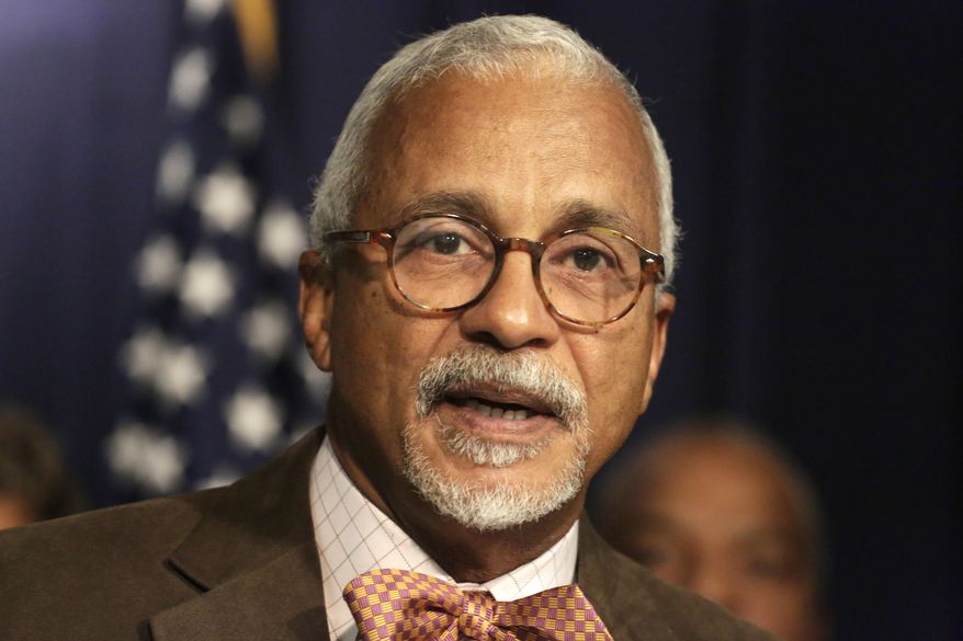 FILE - In this Dec. 14, 2015, file photo, Illinois State Sen. Donne Trotter speaks during a news conference held by the Illinois Legislative Black Caucus in Chicago. Illinois lawmakers who ended the nation's longest state fiscal standoff since the Great Depression have an ironic strategy for digging out of debt: taking on even more of it. Chicago Democratic Sen. Trotter says late-payment interest on $15 billion owed to vendors is far more expensive than interest on selling bonds. (AP Photo/M. Spencer Green, File)