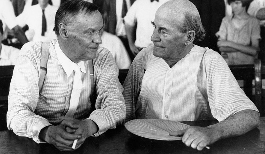 FILE - In this July 1925 file photo, Clarence Darrow, left, and William Jennings Bryan speak with each other during the monkey trial in Dayton, Tenn. On Friday, July 13, 2017, at the Rhea County Courthouse in Dayton, the public will behold a 10-foot statue of the rumpled skeptic Darrow, who argued for evolution in the 1925 trial. It will stand at a respectful distance on the opposite side of the courthouse from an equally huge statue of Bryan, the eloquent Christian defender of the biblical account of creation, which was installed in 2005. (AP Photo, File)