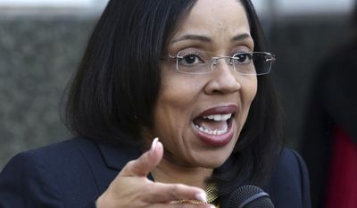 FILE - In this March 16, 2017, file photo, Florida State Attorney Aramis Ayala, during a news conference on the steps of the Orange County Courthouse, announces that her office will no longer pursue the death penalty as a sentence in any case brought before the 9th Judicial Circuit of Florida. There was nothing unusual about a June 19 traffic stop in Orlando -- except the driver happened to be Ayala, Florida’s first African-American state attorney, who also happens to be in a legal fight with the governor over the death penalty. (Joe Burbank/Orlando Sentinel via AP, File)