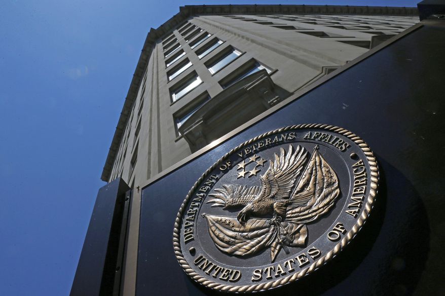In this June 21, 2013, file photo, the seal affixed to the front of the Department of Veterans Affairs building in Washington. (AP Photo/Charles Dharapak, File)