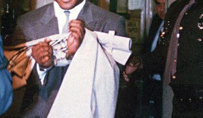 Mike Tyson reigned as the undisputed world heavyweight champion and holds the record as the youngest boxer to win a heavyweight title at 20 years, 4 months and 22 days old. Tyson was arrested in July 1991 for the rape of 18-year-old Desiree Washington, Miss Black Rhode Island, in an Indianapolis hotel room. On March 26, 1992, Tyson was sentenced to six years in prison along with four years of probation. Despite being 25 years old at the time of the crime, he was assigned to the Indiana Youth Center in April 1992, and he was released in March 1995 after serving less than three years of his six-year sentence. During his incarceration, Mike Tyson converted to Islam. He took the Muslim name Malik Abdul Aziz. Due to his conviction, Tyson was required to register as a tier II sex offender under federal law