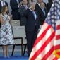 U.S. President Donald Trump salutes as he watches with his wife Melania Trump the traditional Bastille Day military parade on the Champs Elysees, in Paris, Friday, July 14, 2017. (AP Photo/Michel Euler) ** FILE **