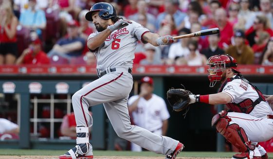 Washington Nationals&#39; Anthony Rendon watches an RBI single off Cincinnati Reds starting pitcher Tim Adleman during the first inning of a baseball game, Friday, July 14, 2017, in Cincinnati. (AP Photo/John Minchillo)