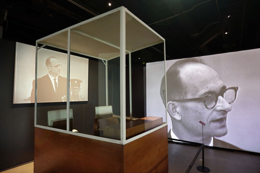 The bulletproof glass booth in which Adolf Eichmann testified during his trial in Jerusalem District Court is displayed in the "Operation Finale: The Capture & Trial of Adolf Eichmann" exhibit at the Museum of Jewish Heritage, in New York, Friday, July 14, 2017. (AP Photo/Richard Drew)