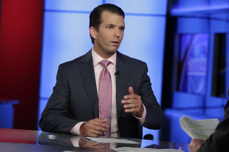 In this photo taken July 11, 2017, Donald Trump Jr. is interviewed by host Sean Hannity on his Fox News Channel television program, in New York. A Russian-American lobbyist says he attended a June 2016 meeting with President Donald Trump's son, marking another shift in the account of a discussion that was billed as part of a Russian government effort to help the Republican's White House campaign. (AP Photo/Richard Drew)