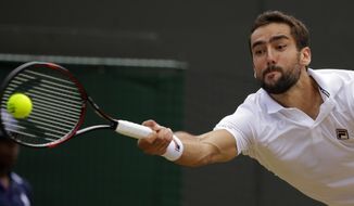 Croatia&#39;s Marin Cilic returns to Luxembourg&#39;s Gilles Muller during their Men&#39;s Singles Quarterfinal Match on day nine at the Wimbledon Tennis Championships in London Wednesday, July 12, 2017. (AP Photo/Alastair Grant)