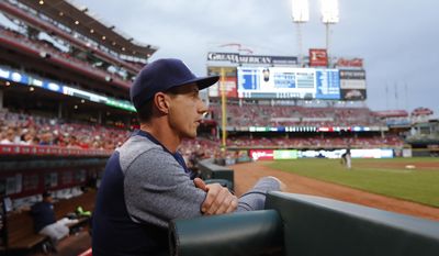 FILE - In this April 14, 2017, file photo, Milwaukee Brewers manager Craig Counsell watches from the dugout during the second inning of the team&#x27;s baseball game against the Cincinnati Reds in Cincinnati. It has been quite a season so far for a club that was supposed to be in the second full year of a rebuilding project. At 50-41, Milwaukee is in first place at the break for the fifth time in franchise history, and the first time since 2014. “I guess I’m surprised with where we’re sitting right now, with the (size of the) lead. I think everybody is in baseball,” Counsell said. “How we’ve played–not really that surprised. We’ve earned our record.” (AP Photo/John Minchillo, File)