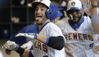 CORRECTS TO GRAND SLAM, INSTEAD OF THREE-RUN HOME RUN - Milwaukee Brewers&#39; Ryan Braun celebrates his grand slam during the second inning of a baseball game against the Philadelphia Phillies on Friday, July 14, 2017, in Milwaukee. (AP Photo/Morry Gash)