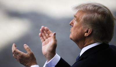 U.S President Donald Trump applauds as he attends the Bastille Day parade in Paris, Friday, July 14, 2017. Paris has tightened security before its annual Bastille Day parade, which this year is being opened by American troops with President Donald Trump as the guest of honor to commemorate the 100th anniversary of the United States&#x27; entry into World War I. (AP Photo/Markus Schreiber)