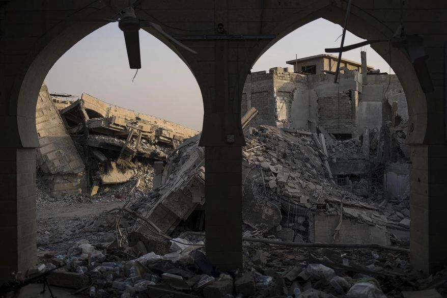 In this July 9, 2017 photo, destroyed buildings sit on the Old City of Mosul, Iraq. Iraq’s U.S.-backed forces succeeded in wresting Mosul from the Islamic State group but at the cost of enormous destruction. The nearly 9-month fight culminated in a crescendo of devastation _ the blasting of the historic Old City to root out the militants’ final pockets.(AP Photo/Felipe Dana)