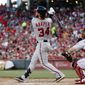 Washington Nationals&#39; Bryce Harper watches his solo home run off Cincinnati Reds starting pitcher Tim Adleman during the fifth inning of a baseball game, Friday, July 14, 2017, in Cincinnati. (AP Photo/John Minchillo)