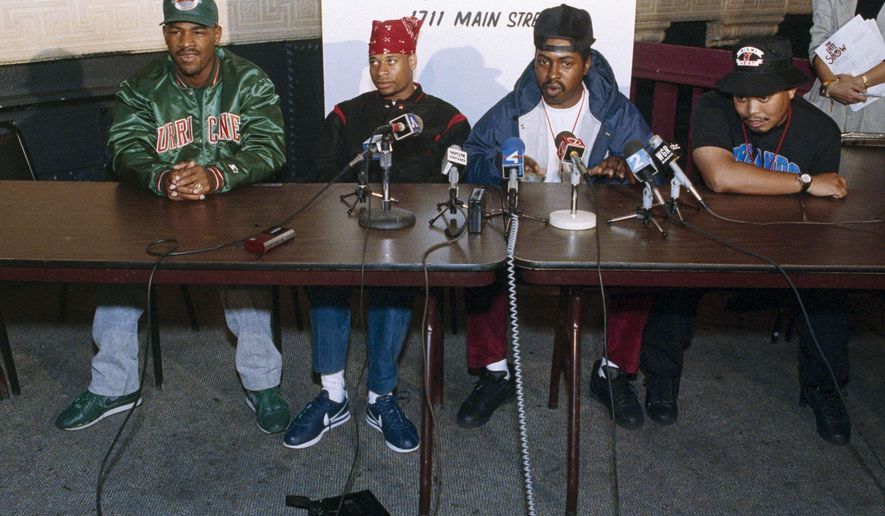 FILE - In this Oct. 3, 1990, file photo, 2 Live Crew member Mr. Mixx (David Hobbs), second from right, speaks to reporters at the Late Show night club in Niagara Falls, N.Y., while being joined by fellow group members, J.T. Money, left, Brother Marquis, second from left; and Fresh Kid Ice, right. Christopher Wong Won, known as Fresh Kid Ice and a founding member of the Miami hip-hop group 2 Live Crew has died Thursday, July 13, 2017, at a Veterans Affairs hospital in Miami as a result of "medical conditions" he had suffered for several years, the group's manager, DJ Debo, said. He was 53. (AP Photo/Mike Groll, File)