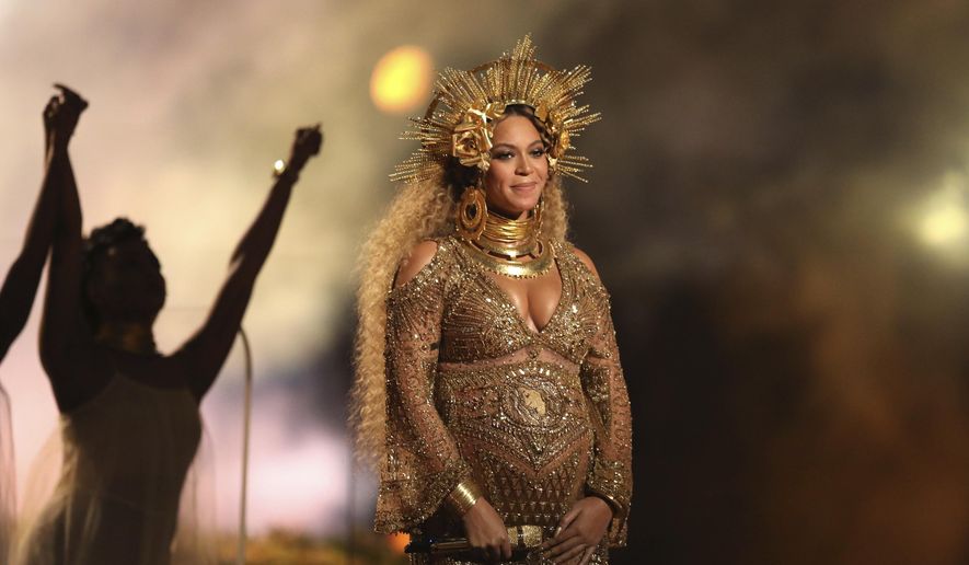 This Feb. 12, 2017, file photo shows Beyonce performing at the 59th annual Grammy Awards in Los Angeles. Beyonce debuted her newborn twins Sir Carter and Rumi in an Instagram post on July 13, 2017. (Photo by Matt Sayles/Invision/AP, File)