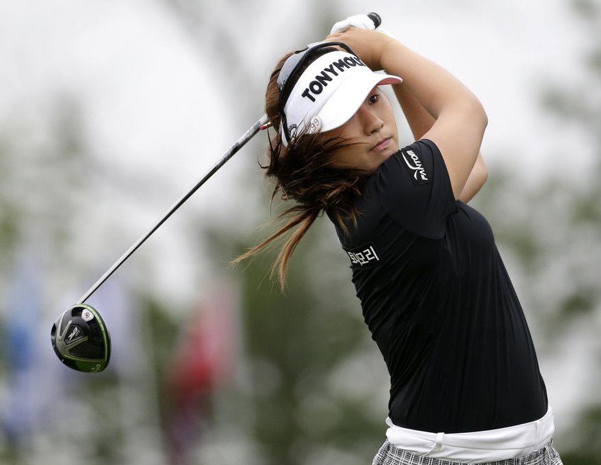 Jeongeun6 Lee, of South Korea, watches her drive from the 17th tee during the second round of the U.S. Women's Open Golf Championship at Trump National Golf Club in Bedminster, N.J., Friday, July 14, 2017. She uses the number 6 because there are six Korean golfers with similar names and she wants her fans to know which one she is when mentioned. (AP Photo/Seth Wenig)