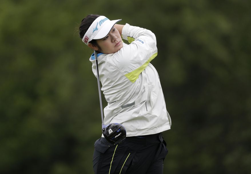 Fumika Kawagishi, of Japan, watches her drive off the ninth tee during the second round of U.S. Women's Open Golf Championship at Trump National Golf Club in Bedminster, N.J., Friday, July 14, 2017. (AP Photo/Seth Wenig)