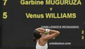 Spain&#39;s Garbine Muguruza celebrates after beating Venus Williams of the United States to win the Women&#39;s Singles final match on day twelve at the Wimbledon Tennis Championships in London Saturday, July 15, 2017. (AP Photo/Tim Ireland)