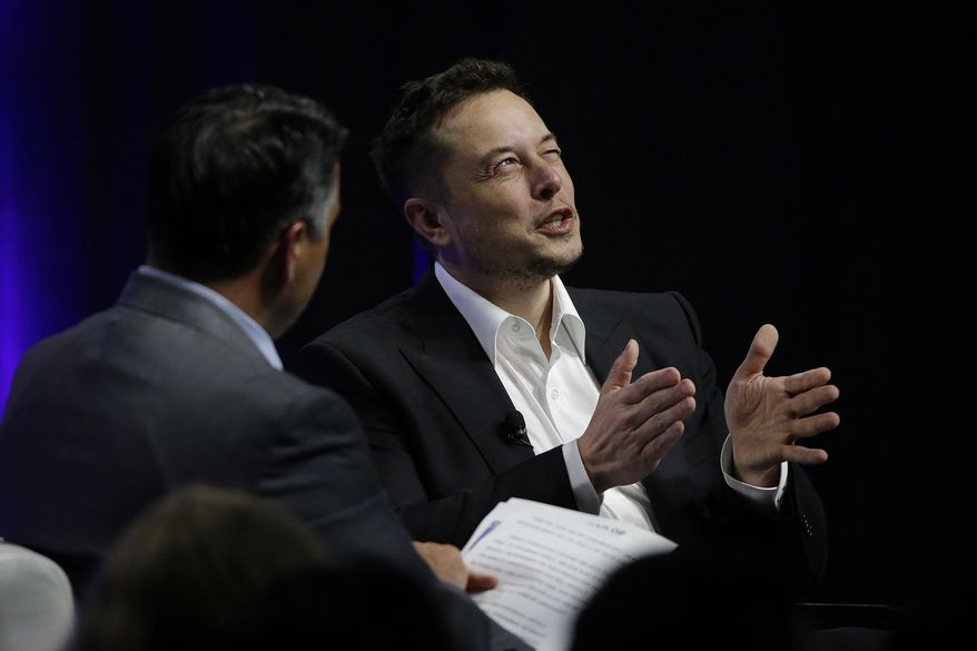 Tesla and SpaceX CEO Elon Musk responds to a question by Nevada Republican Gov. Brian Sandoval during the closing plenary session entitled &amp;quot;Introducing the New Chairs Initiative - Ahead&amp;quot; on the third day of the National Governors Association&#39;s meeting Saturday, July 15, 2017, in Providence, R.I. (AP Photo/Stephan Savoia)