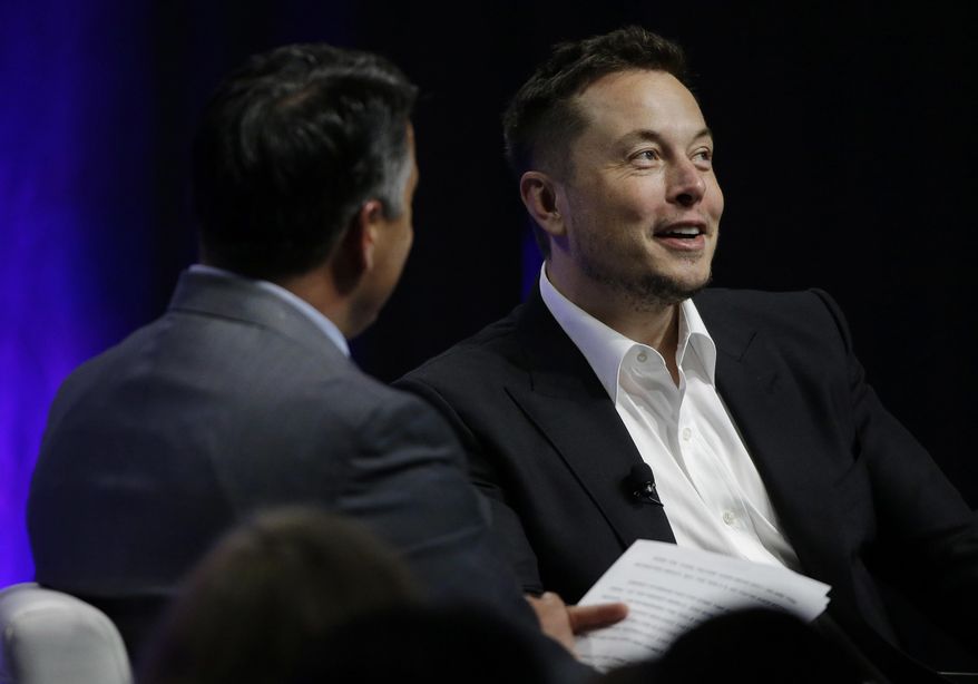 Tesla and SpaceX CEO Elon Musk responds to a question by Nevada Republican Gov. Brian Sandoval during the closing plenary session entitled &amp;quot;Introducing the New Chairs Initiative - Ahead&amp;quot; on the third day of the National Governors Association&#x27;s meeting Saturday, July 15, 2017, in Providence, R.I. (AP Photo/Stephan Savoia)