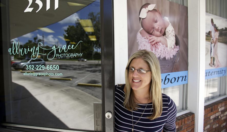 In this photo taken July 10, 2017, Cathy Cooper leaves her photo studio in Ocala, Fla. Cooper, a cancer survivor, is concerned that if the GOP health bill goes through, she may not have access to the kind of health insurance she needs to make sure she stays cancer free. President Donald Trump has often said he doesn’t want people “dying in the streets” for lack of health care. But in the U.S., people decline slowly from chronic health conditions. Preventive care and routine screening can make a big difference for those at risk of illnesses such as heart problems and cancer. (AP Photo/John Raoux)