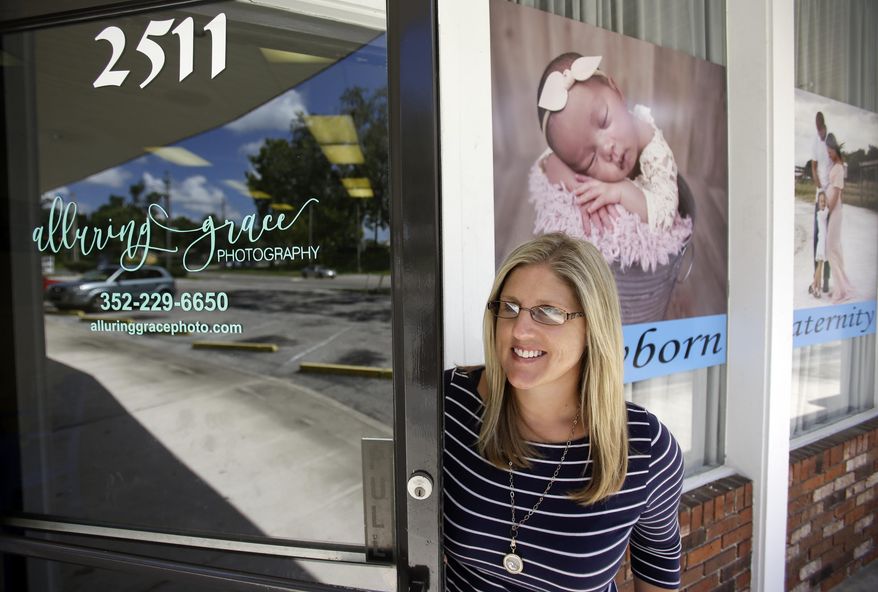 In this photo taken July 10, 2017, Cathy Cooper leaves her photo studio in Ocala, Fla. Cooper, a cancer survivor, is concerned that if the GOP health bill goes through, she may not have access to the kind of health insurance she needs to make sure she stays cancer free. President Donald Trump has often said he doesn’t want people “dying in the streets” for lack of health care. But in the U.S., people decline slowly from chronic health conditions. Preventive care and routine screening can make a big difference for those at risk of illnesses such as heart problems and cancer. (AP Photo/John Raoux)