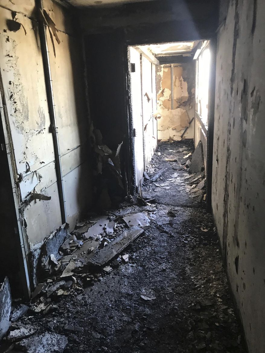 This photo provided by Bruce Campbell, a unit manager in the Marco Polo building in Honolulu, shows the charred interior of the building on Saturday, July 15, 2017. A fire broke out Friday afternoon in a unit on the 26th floor, where all three of the dead were found, Fire Chief Manuel Neves said. The building is not required to have fire sprinklers, which would have confined the blaze to the unit where it started, Neves said. The 36-floor building near the tourist mecca of Waikiki was built in 1971, before sprinklers were mandatory in high-rises. Bruce Campbell via AP)