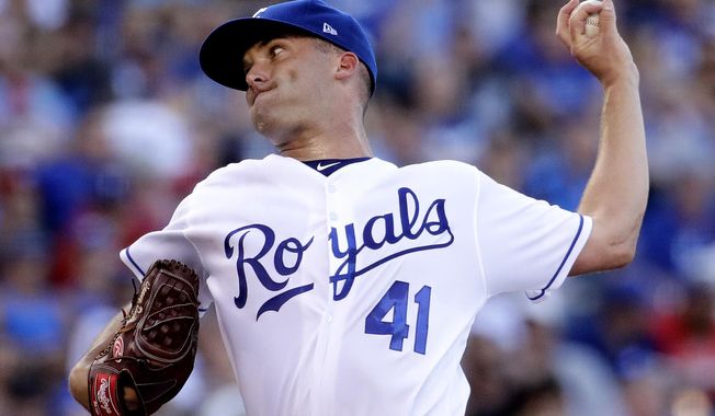 Kansas City Royals starting pitcher Danny Duffy throws during the third inning of the team's baseball game against the Texas Rangers on Saturday, July 15, 2017, in Kansas City, Mo. (AP Photo/Charlie Riedel)