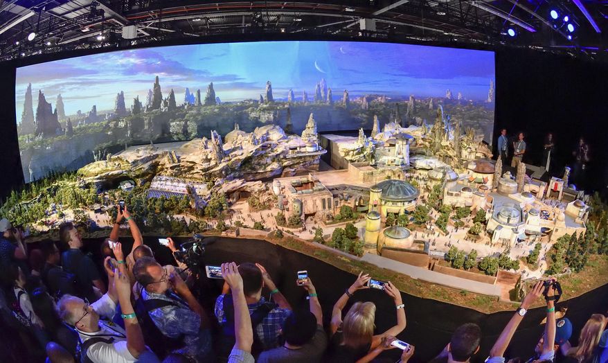 Members of the media get their first look at a 50-foot, detailed model of &amp;quot;Star Wars&amp;quot; land during a media preview for Disney&#39;s D23 Expo in Anaheim, Calf., on Thursday, July 13, 2017. (Jeff Gritchen/The Orange County Register via AP)
